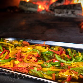 A tray of freshly sliced peppers at The Quiet Bite